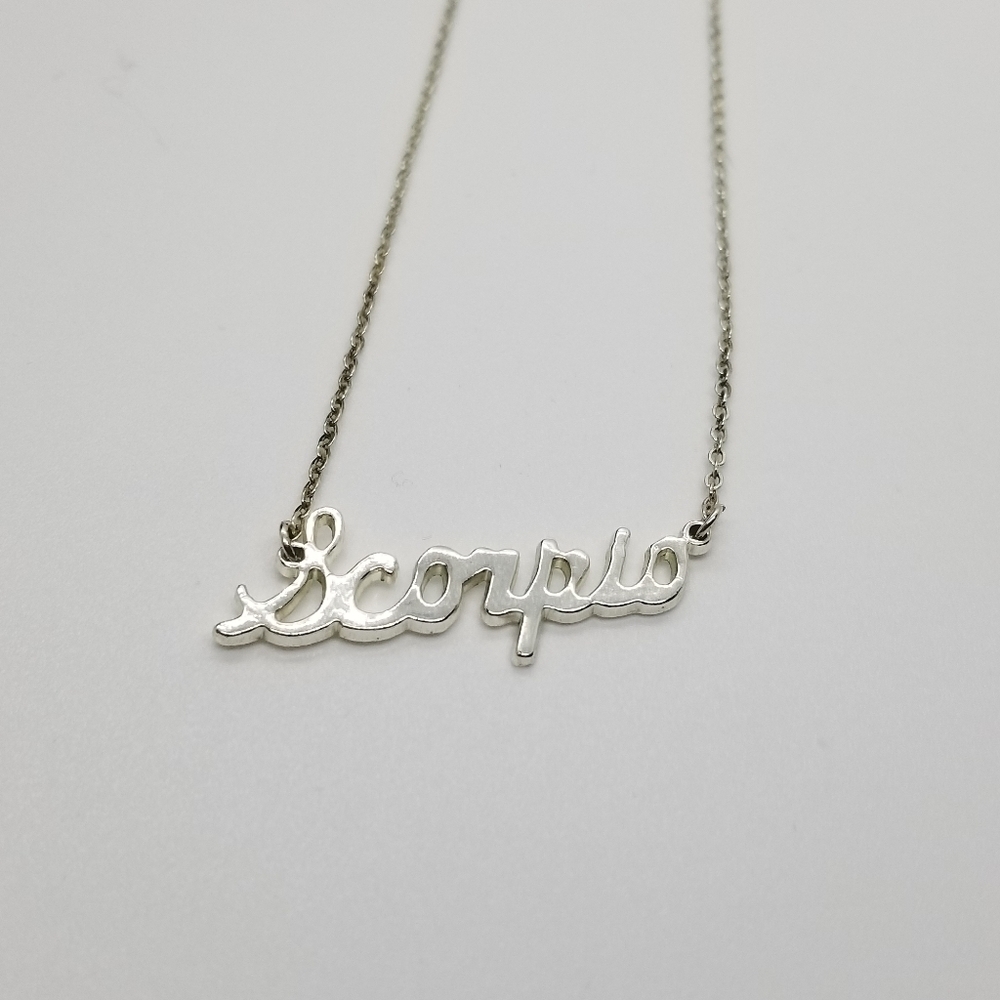 silver tone Scorpio spellout necklace